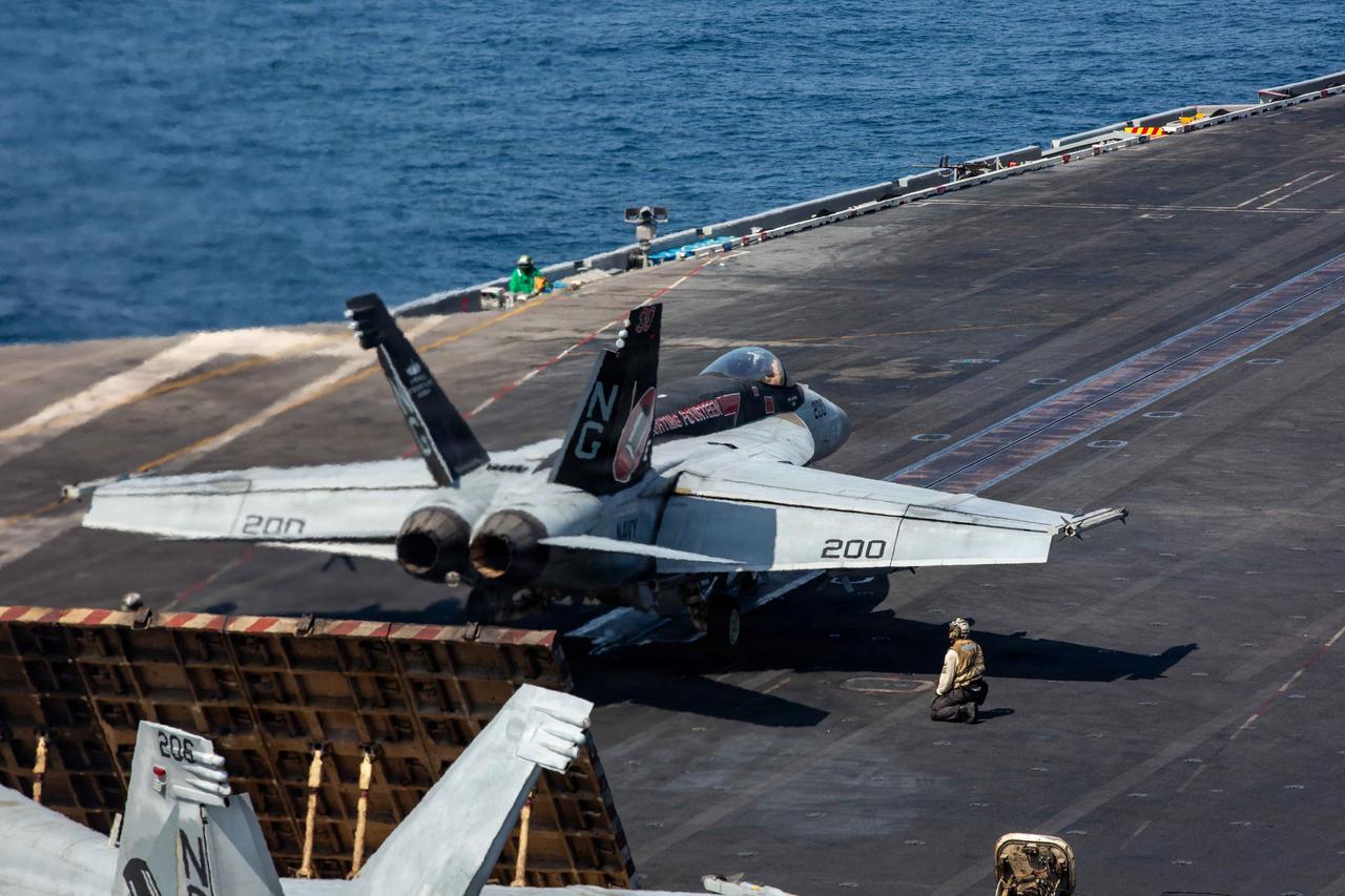 Iran says it targeted US carrier; Washington disputes damage