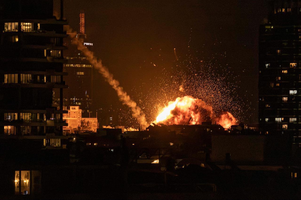 A fireball lights the sky following a missile strike on Tel Aviv on February 28, 2026. (AFP Photo)