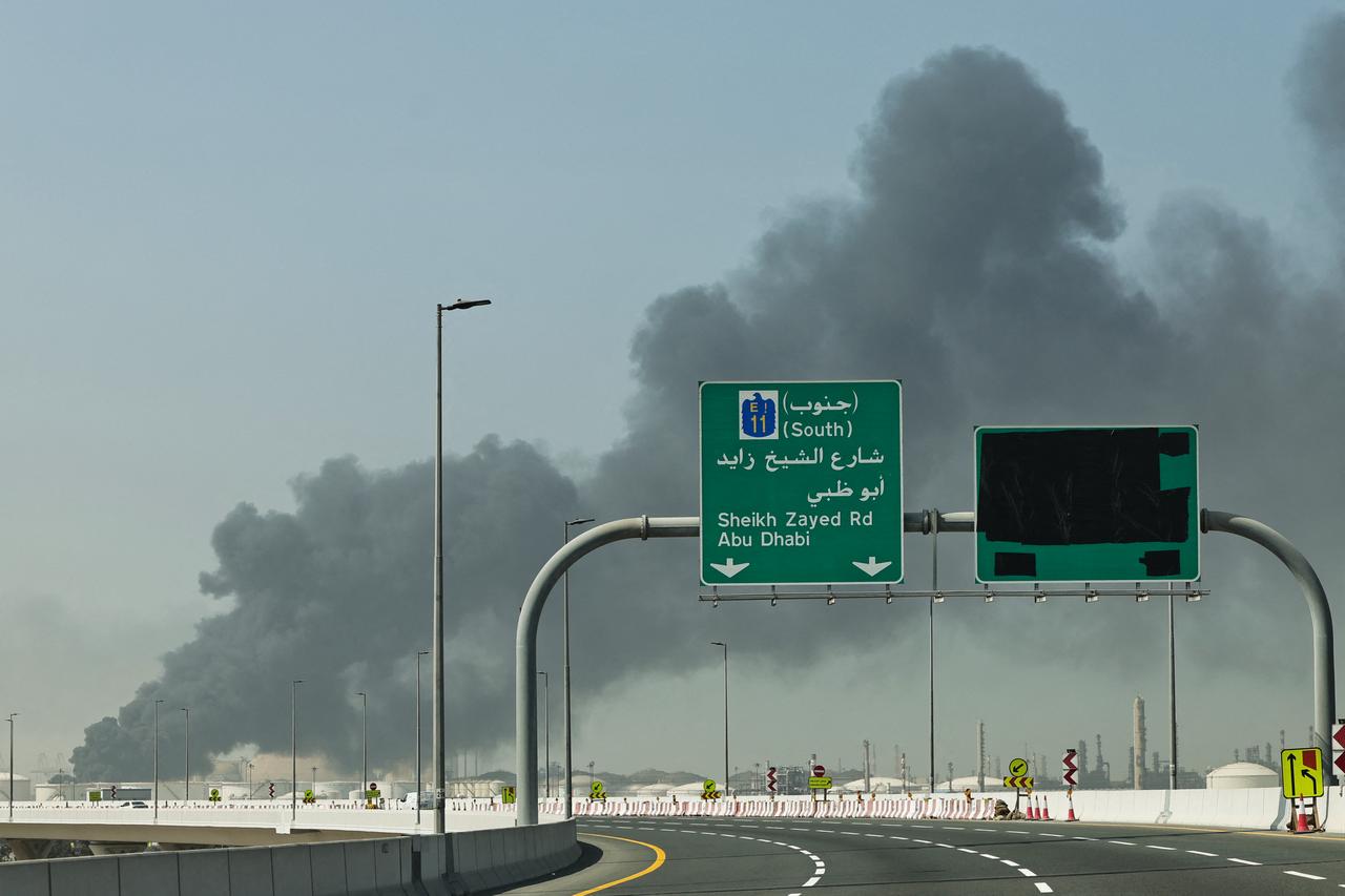 A plume of smoke rises from the port of Jebel Ali following a reported Iranian strike in Dubai on March 1, 2026. (AFP Photo)