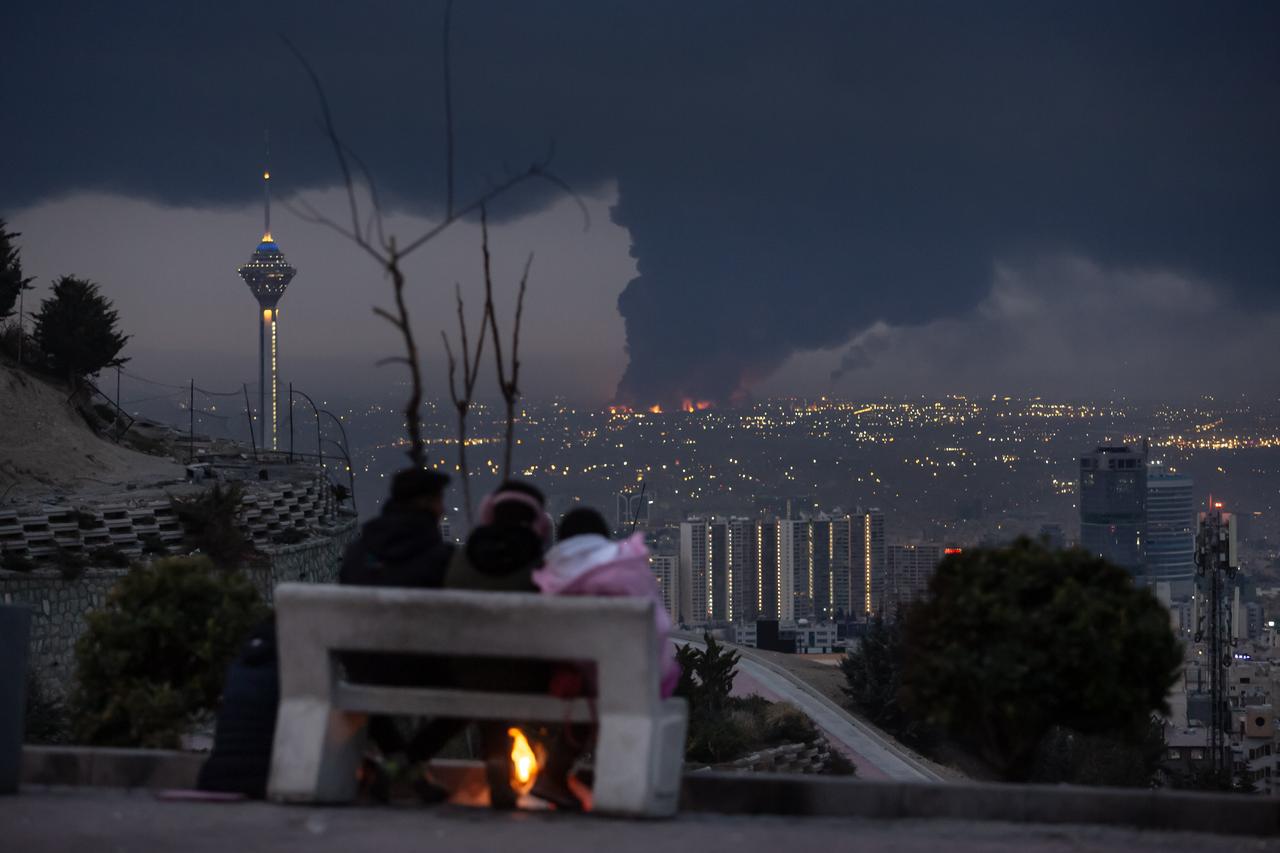 Smoke rises from Shahran oil depot after US and Israeli attacks, leaving numerous fuel tankers and vehicles in the area unusable in Tehran, Iran on March 08, 2026. (AA Photo)