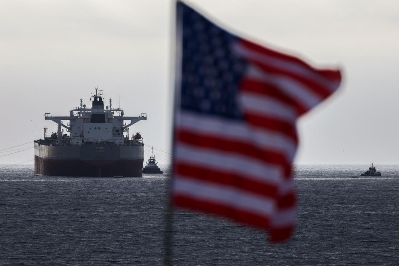 A US flag flutters in the wind as the CHIOS crude oil tanker sits anchored off the coast of the Chevron's El Segundo Refinery in El Segundo, California on March 4, 2026. (AFP Photo)