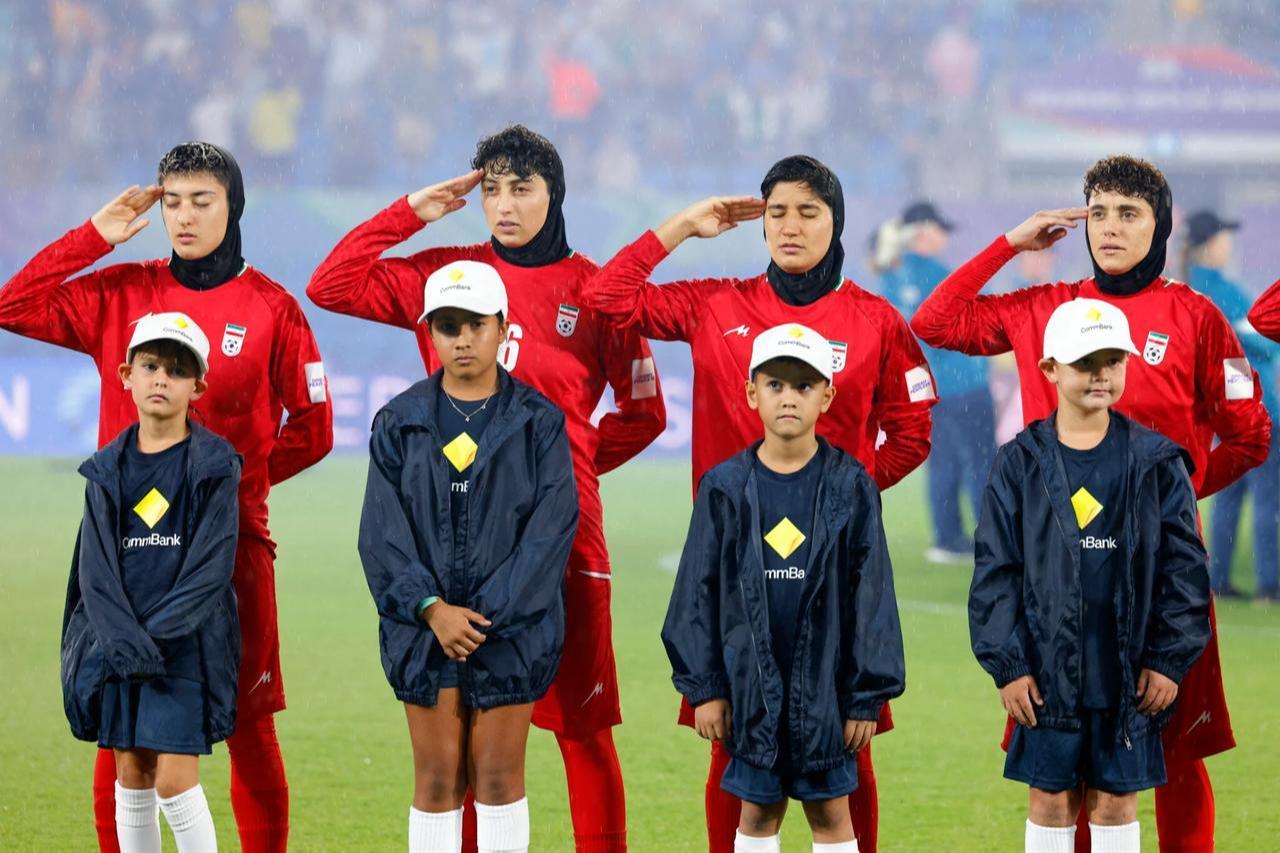 Iran’s players salute the national anthem ahead of the AFC Women’s Asian Cup Australia 2026 match against the Philippines on the Gold Coast, Australia, March 8, 2026. (AFP Photo)