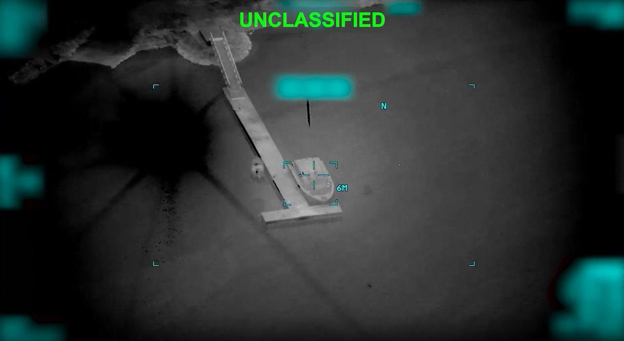 This screen grab obtained from video released by the US Central Command on their X account @CENTCOM on March 10, 2026 shows what they say is an Iranian naval vessel just before it is struck by a projectile "near the Strait of Hormuz" as part of "Operation Epic Fury" on March 10, 2026. (AFP / US Central Command Photo)