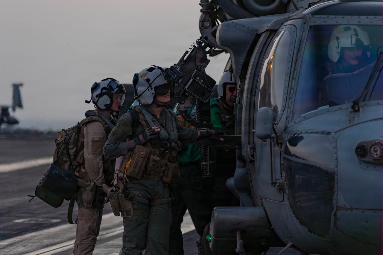 U.S. Sailors prepare an MH-60S Sea Hawk helicopter on the flight deck of the Nimitz-class aircraft carrier USS Abraham Lincoln (CVN 72) in support of Operation Epic Fury, March. 4, 2026. (Photo via U.S. Navy)