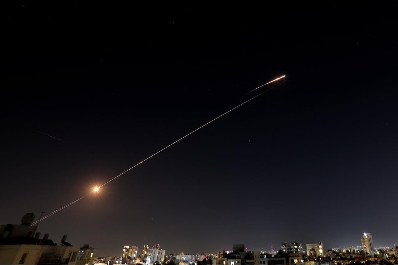 Rocket trails are seen in the sky above the Israeli coastal city of Netanya amid a fresh barrage of Iranian missile attacks on March 11, 2026. (AFP Photo)