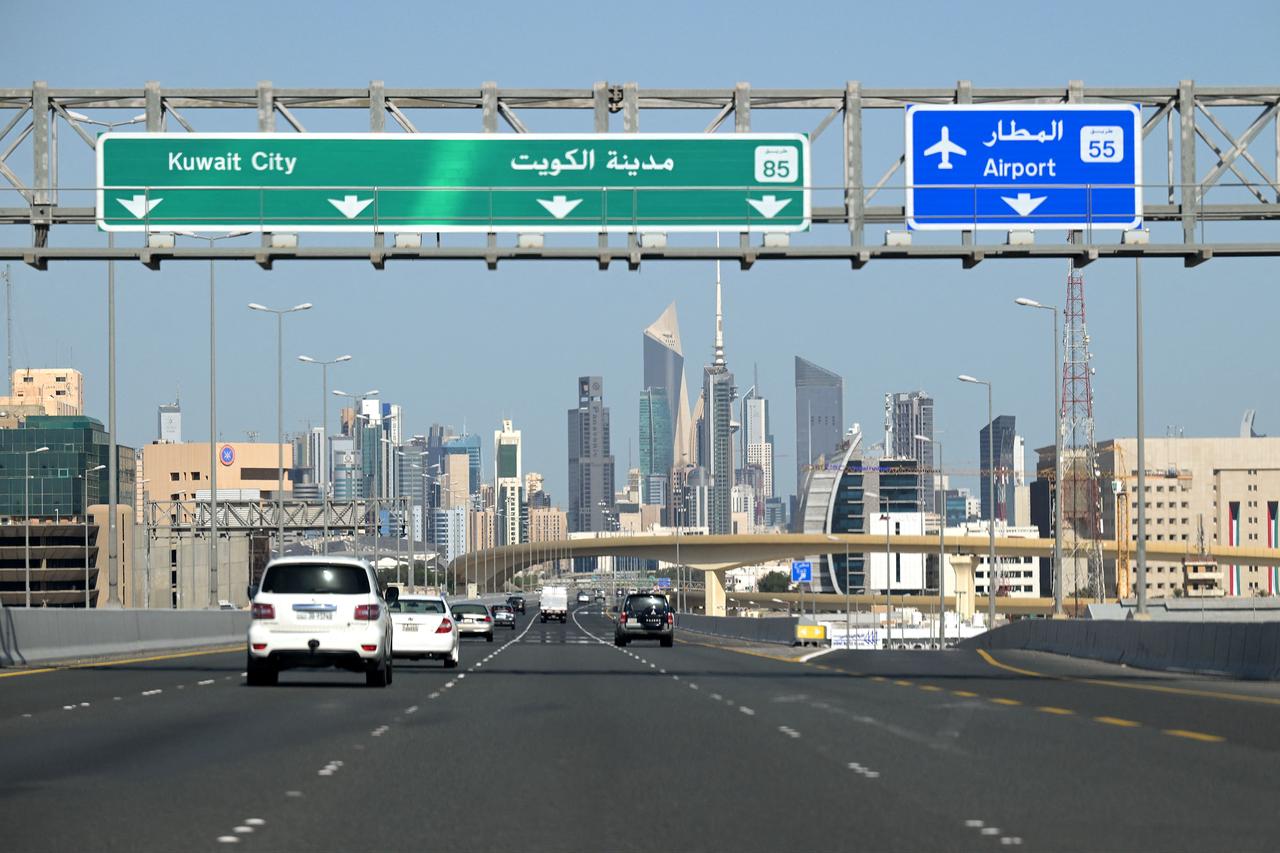 Vehicles drive along the highway leading to and from Kuwait City on March 2, 2026. (AFP Photo)