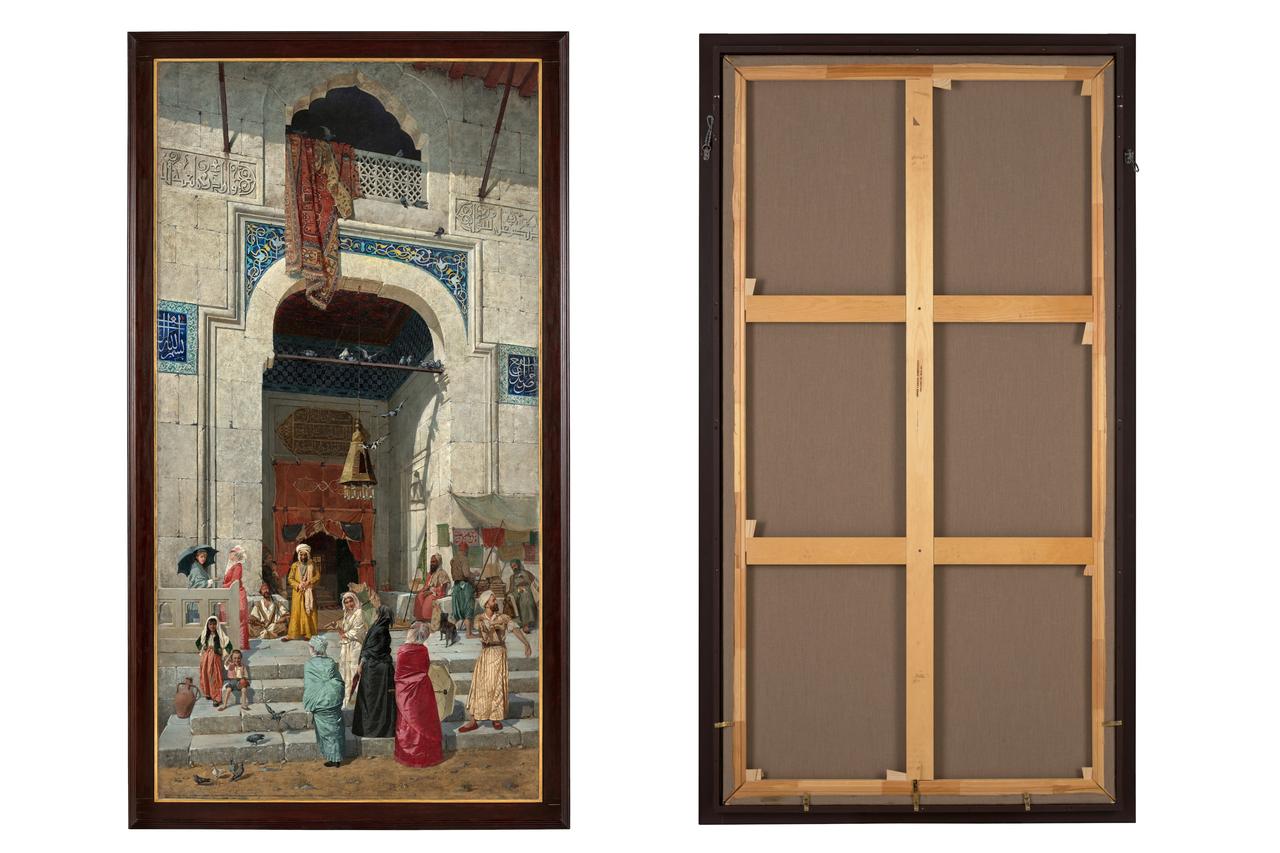 "At the Mosque Door" by Ottoman painter Osman Hamdi Bey is shown from the front and back before its upcoming auction at Bonhams in London, UK. (Photo via Bonhams)