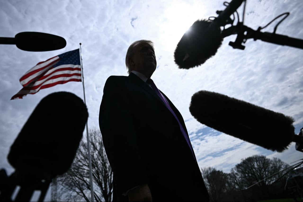 US President Donald Trump speaks to reporters before boarding Marine One as he departs from the South Lawn of the White House in Washington, DC, March 11, 2026. (AFP Photo)