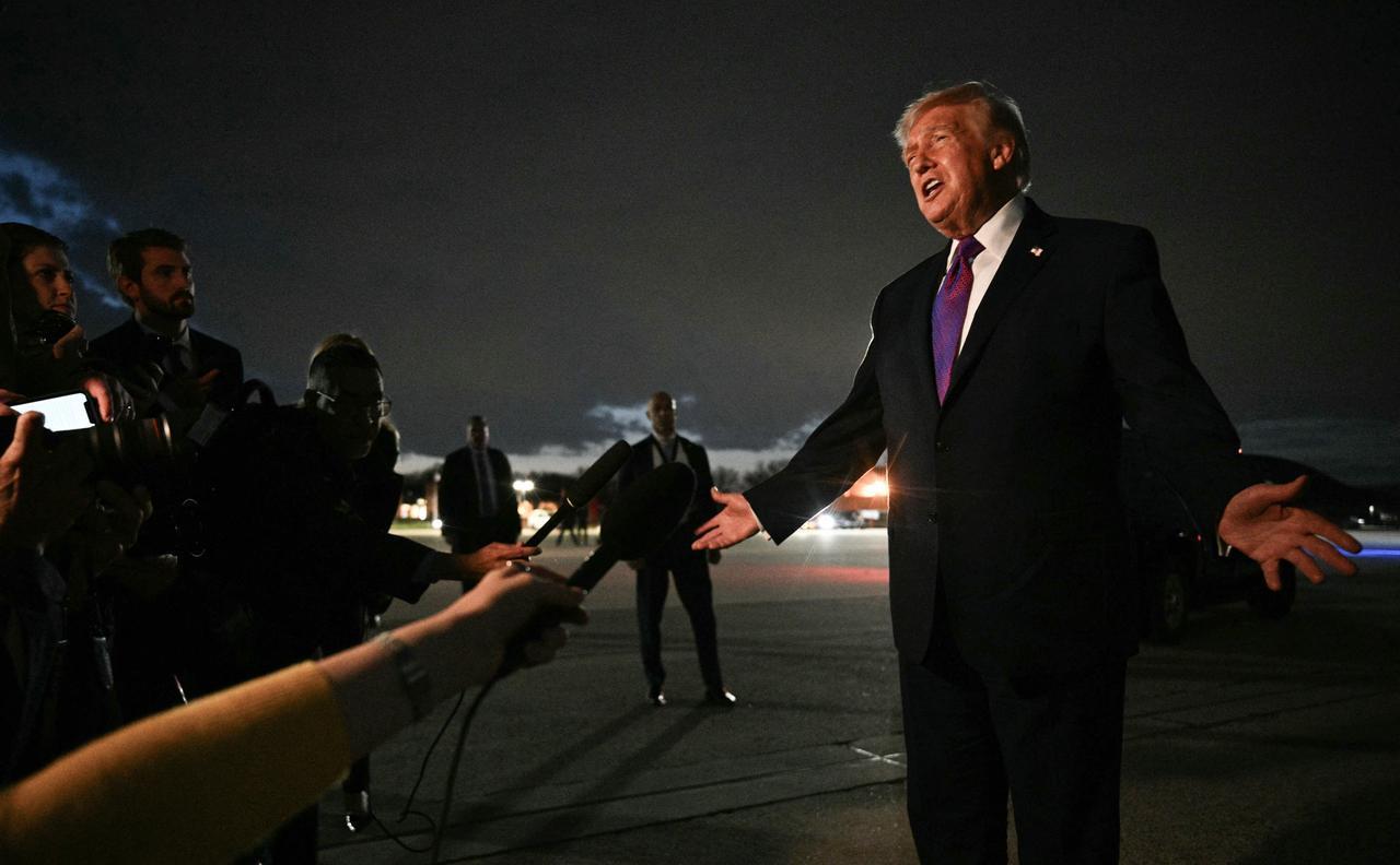 US President Donald Trump speaks to journalists upon returning to Joint Base Andrews, Maryland, on March 11, 2026. (AFP Photo)