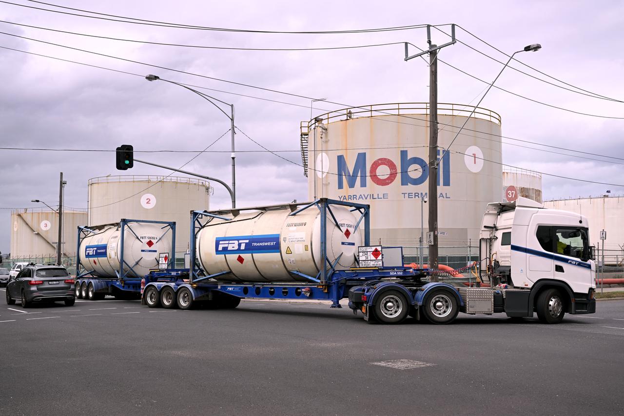 A fuel tanker passes the Mobil fuel distribution centre in the Melbourne suburb of Yarraville on March 12, 2026 as the demands and prices of petrol and diesel soar due to the Middle East conflict. (AFP Photo)