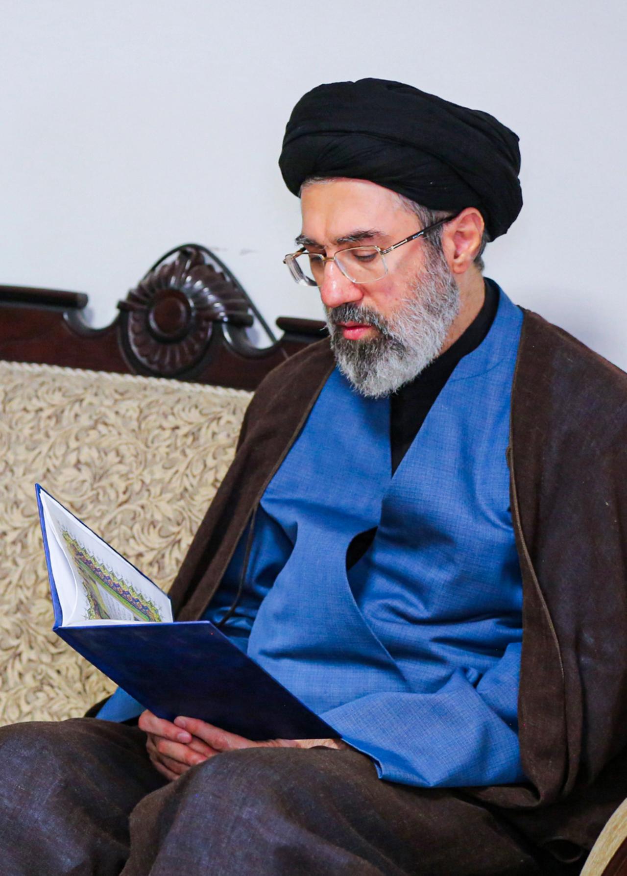 Iran’s new supreme leader Mojtaba Khamenei reads a document. (AA Photo)