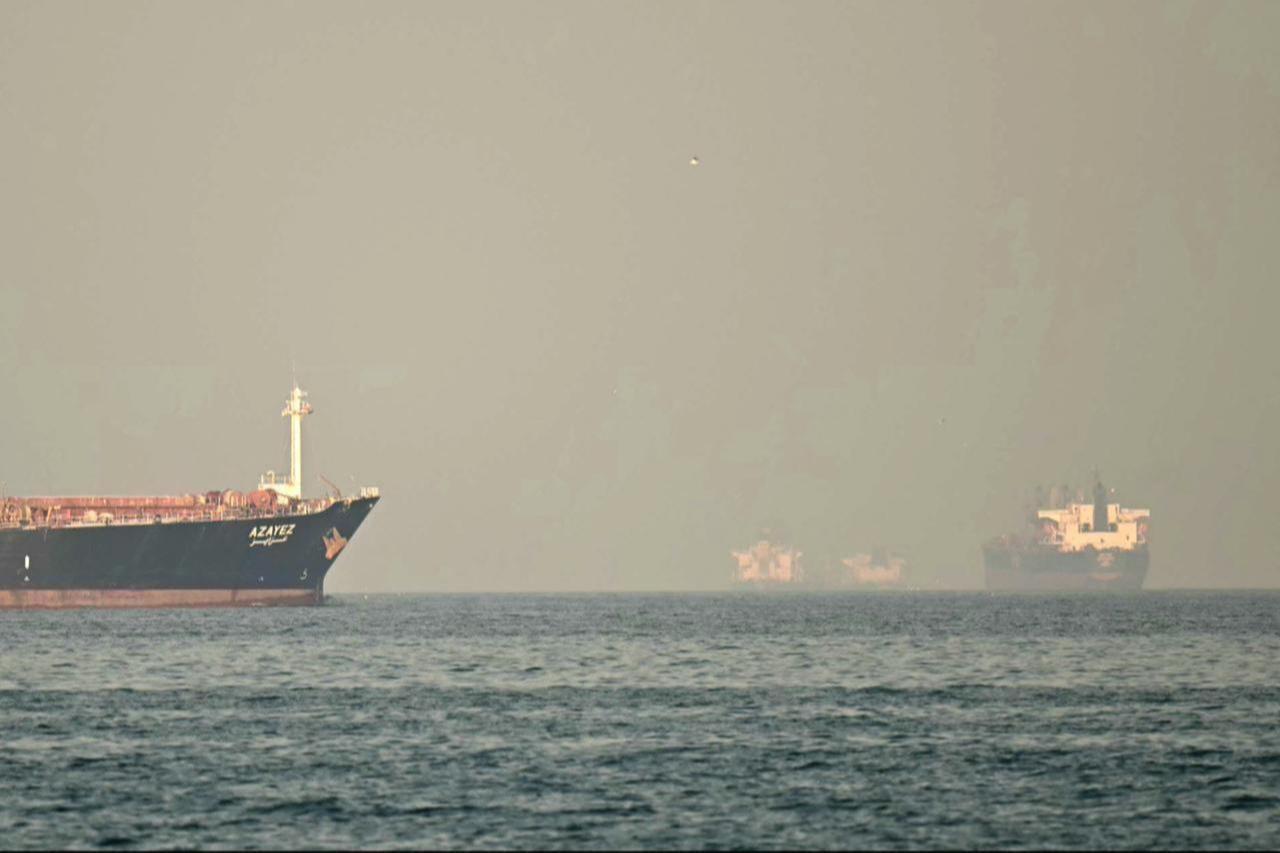Cargo ships and tankers are seen off coast city of Fujairah, in the Strait of Hormuz in the northern Emirate on February 25, 2026. (AFP Photo)