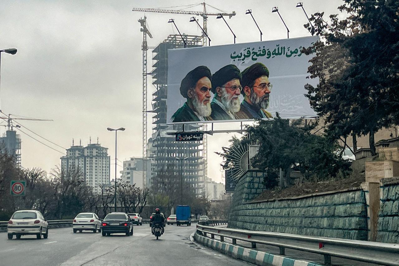 A billboard depicting Iran's supreme leaders since 1979: (L to R) Ayatollahs Ruhollah Khomeini (until 1989), Ali Khamenei (until 2026), and Mojtaba Khamenei (incumbent) is displayed above a highway in Tehran on March 10, 2026. (AFP Photo)