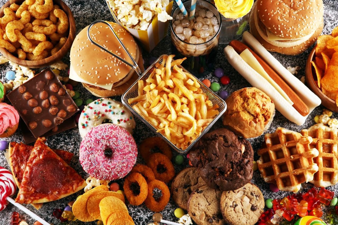 Close-up photo of fast foods and snacks. (Adobe Stock Photo)