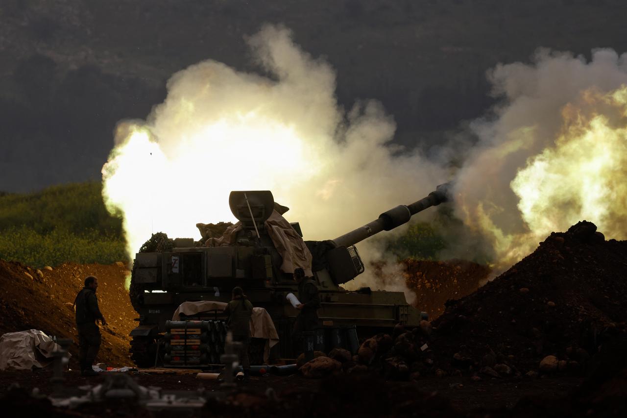 An Israeli artillery unit deployed at a position in the upper Galilee in northern Israel near the Lebanon border, fires towards southern Lebanon on March 14, 2026. (AFP Photo)