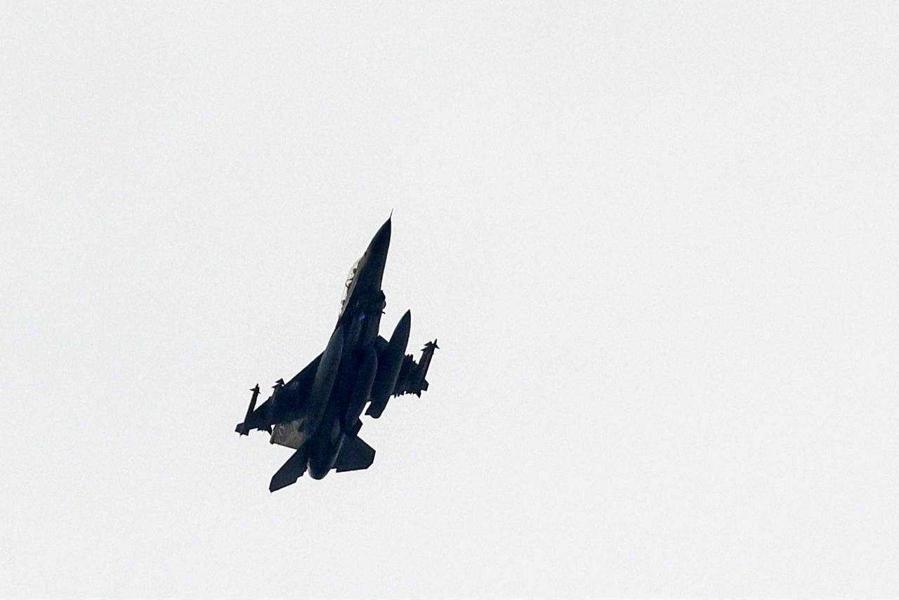 This picture, taken from a position in northern Israel, shows an Israeli Air Force fighter jet flying over the border area with southern Lebanon on March 13, 2026. (AFP Photo)