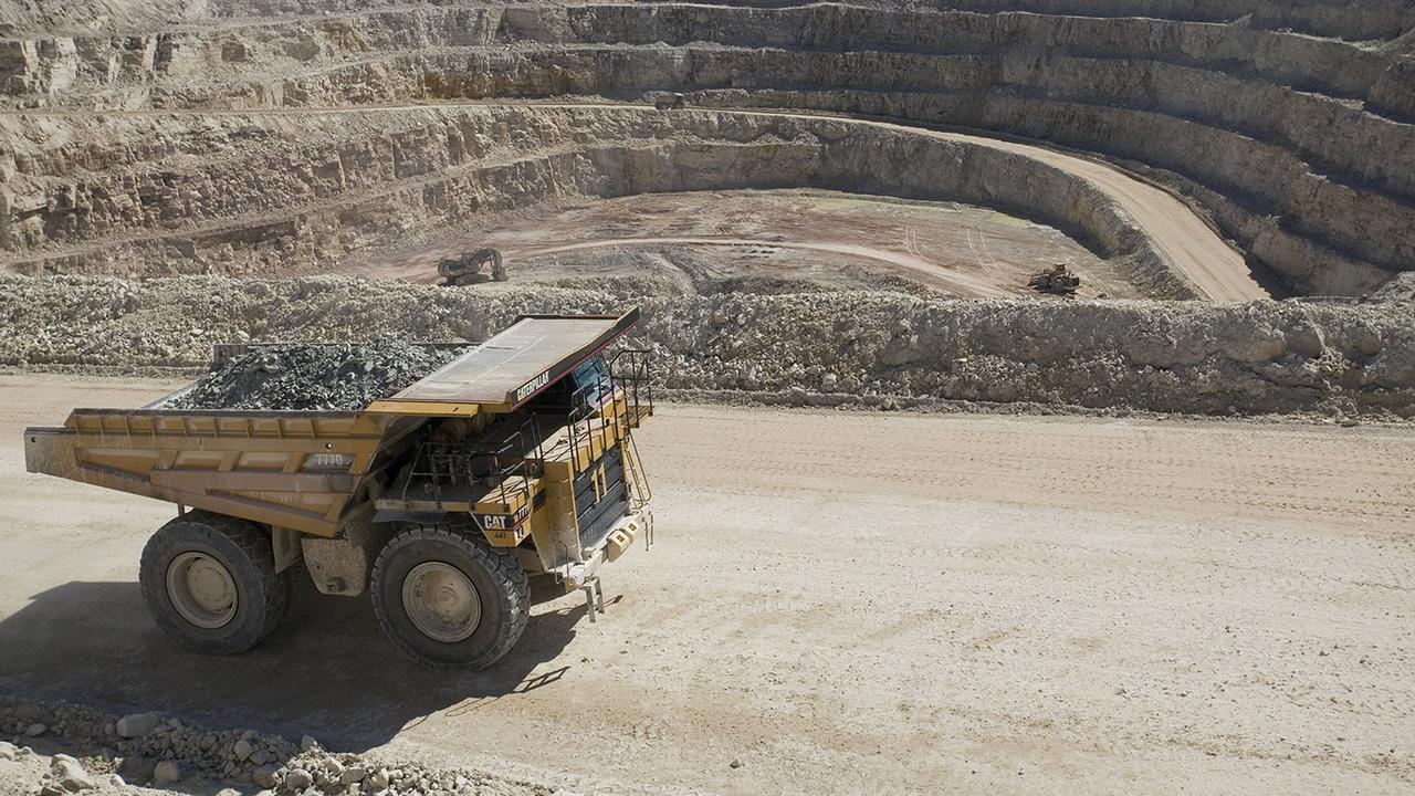 A one-hundred-ton Caterpillar truck carries ore from the Sue E open pit uranium mine at Areva Resources, 16 July 2007, in McClean Lake, Canada. (AFP Photo)