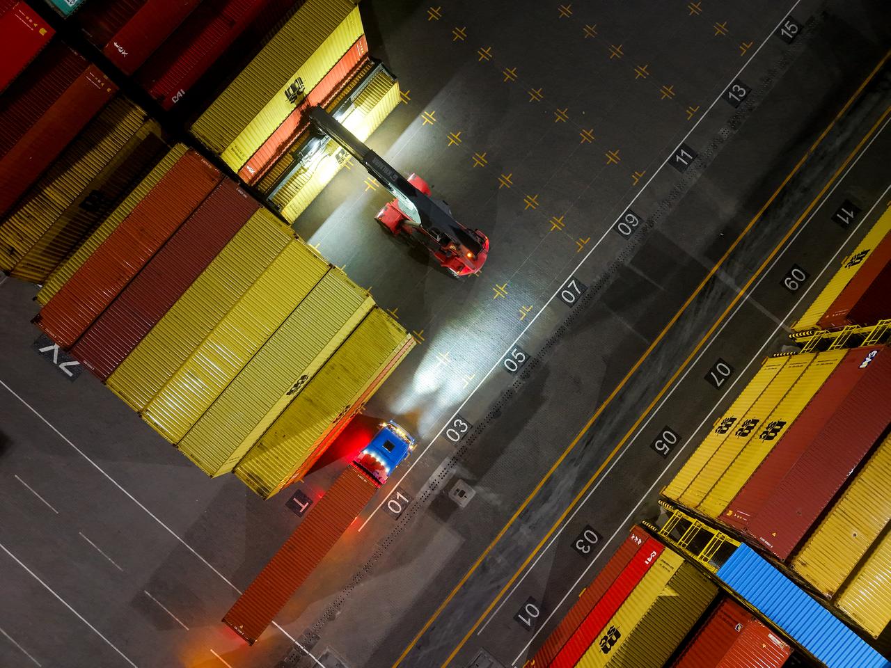 A view of shipping containers waiting at Umm Qasr Port located in Basra Governorate in southern Iraq on March 12, 2026. (AA Photo)