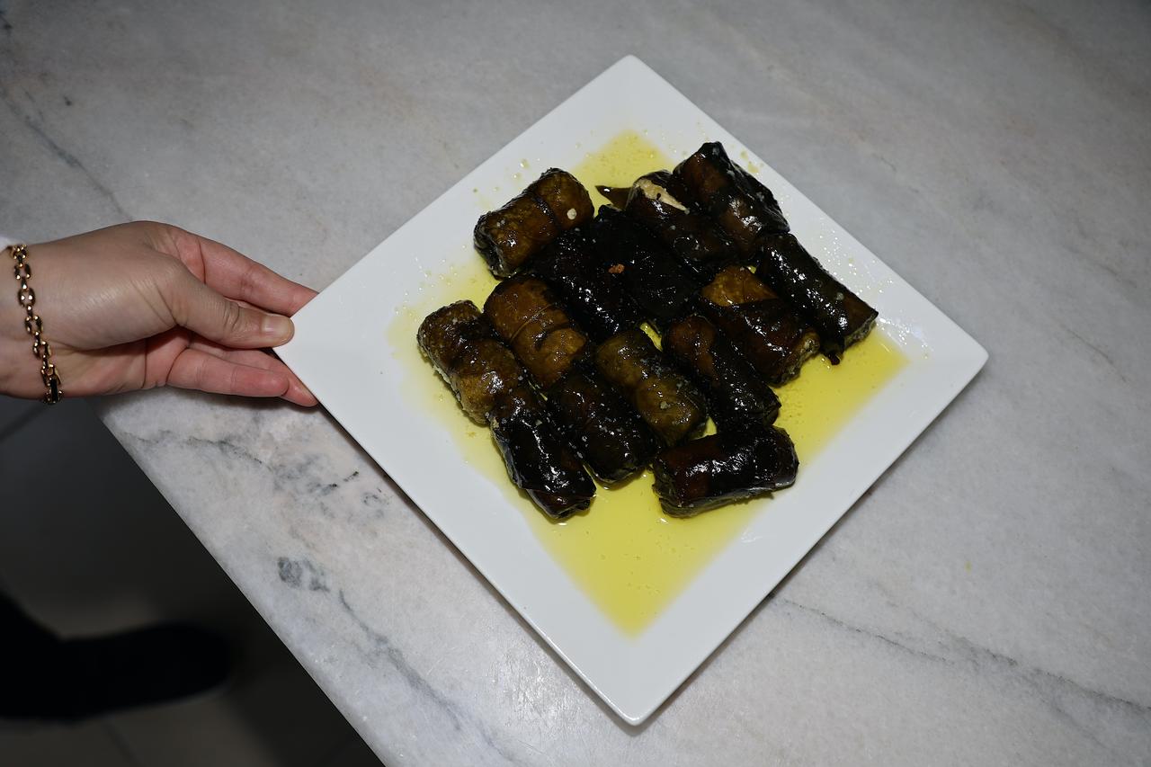 A plate of lor dolmasi, one of Bayburt’s geographically indicated dishes made with evelik leaves and lor cheese, is presented for serving in Bayburt, Türkiye, March 14, 2026. (AA Photo)