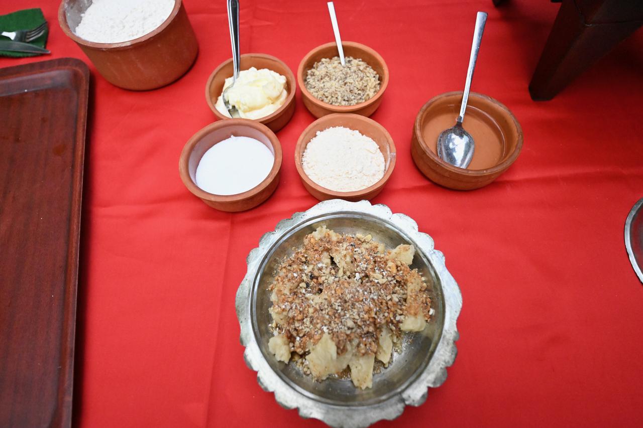 Ingredients used to prepare kedi batmaz, including flour, butter, walnuts and kes, are displayed during a cooking demonstration in Bolu, Türkiye, March 15, 2026. (AA Photo)