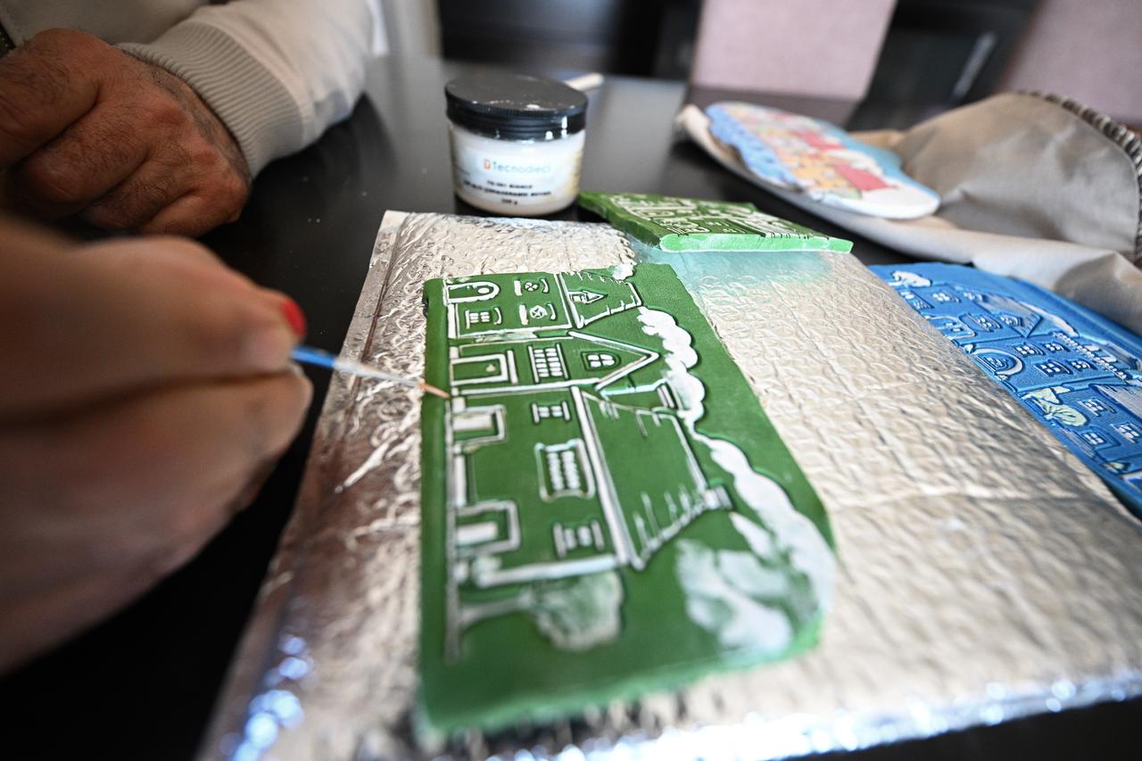 Prof. Dr. Murat Kaya works on a hand-painted decorative piece in his home studio in Duzce, Türkiye, March 15, 2026. (AA Photo)