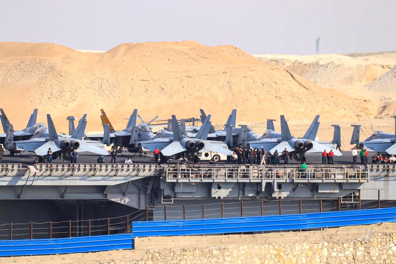 A U.S. aircraft carrier transits the Suez Canal in the city of Ismailia, Egypt, which connects the Mediterranean and Red Seas, on March 13, 2026. (AA Photo)