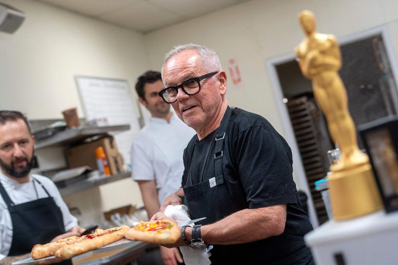 Chef Wolfgang Puck poses with pide fresh out of the oven at the 94th Annual Academy Awards Governors Ball Press Preview held at the Hollywood And Highland Center, in Hollywood, California on March 24, 2022. (AFP Photo)