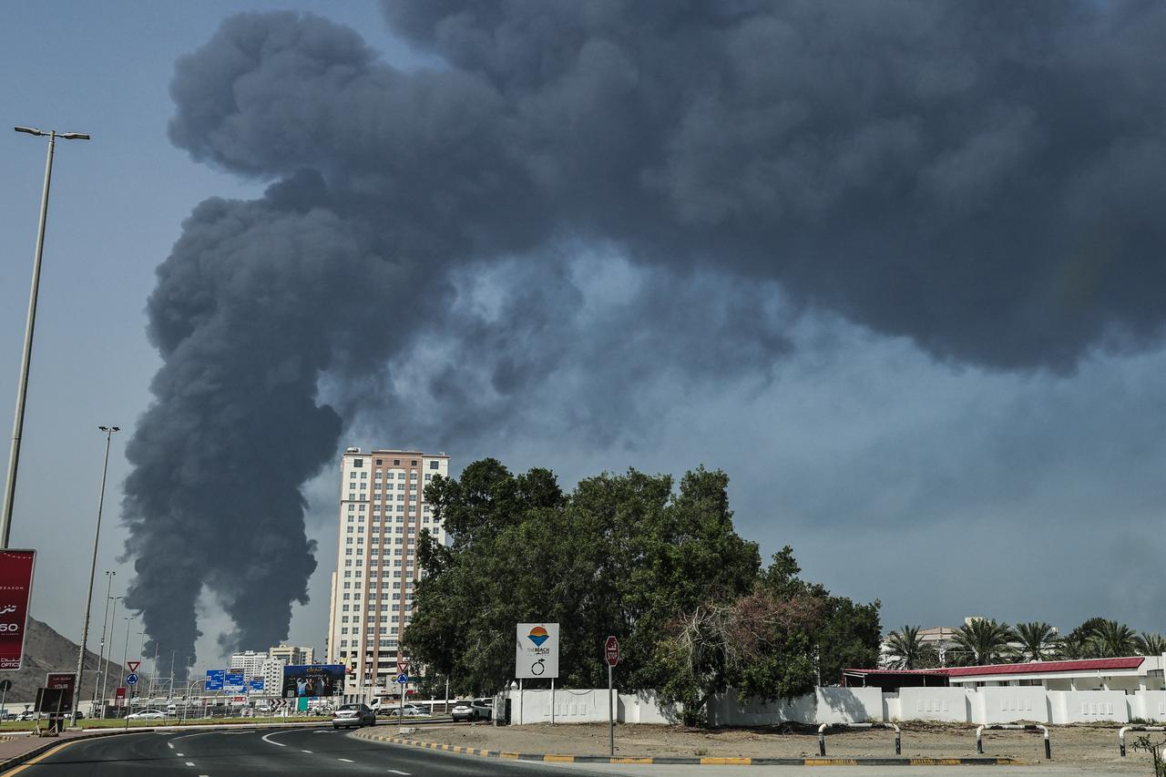 Smoke rises from the direction of an energy installation in the Gulf emirate of Fujairah on March 14, 2026. (AFP Photo)