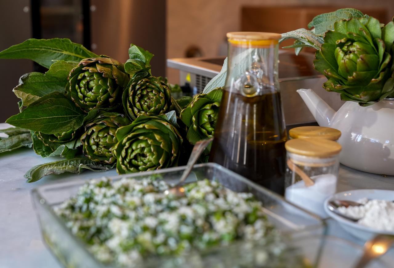 Fresh artichokes and ingredients used to prepare traditional olive oil artichoke dolma are displayed in Izmir, Türkiye, March 16, 2026. (AA Photo)