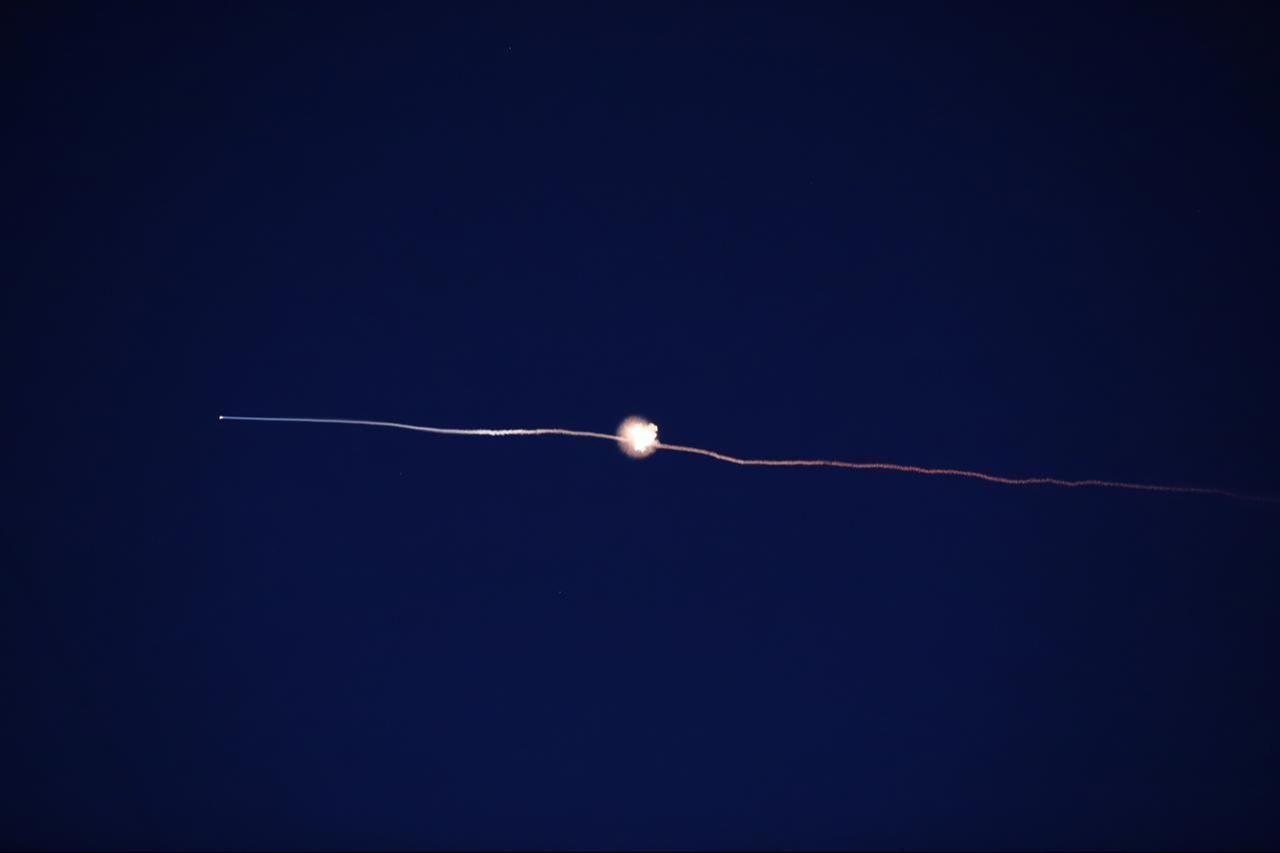 Missiles launched from Iran in retaliation for Israeli attacks are seen in the night sky over the city of Hebron in the West Bank, March 06, 2026. (AA Photo)