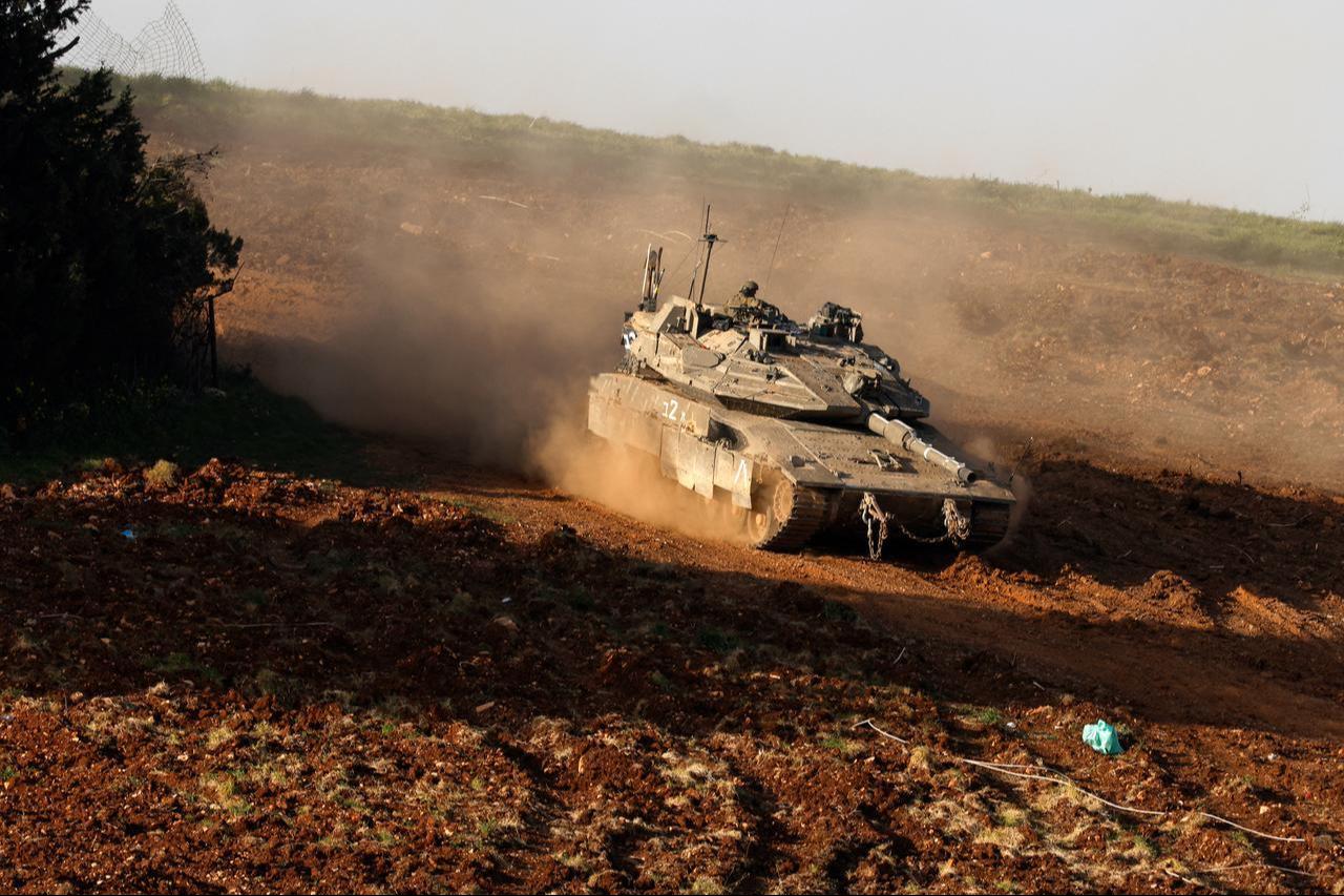 An Israeli army tank deploys at a position in the Upper Galilee in northern Israel near the border with Lebanon on March 12, 2026. (AFP Photo)