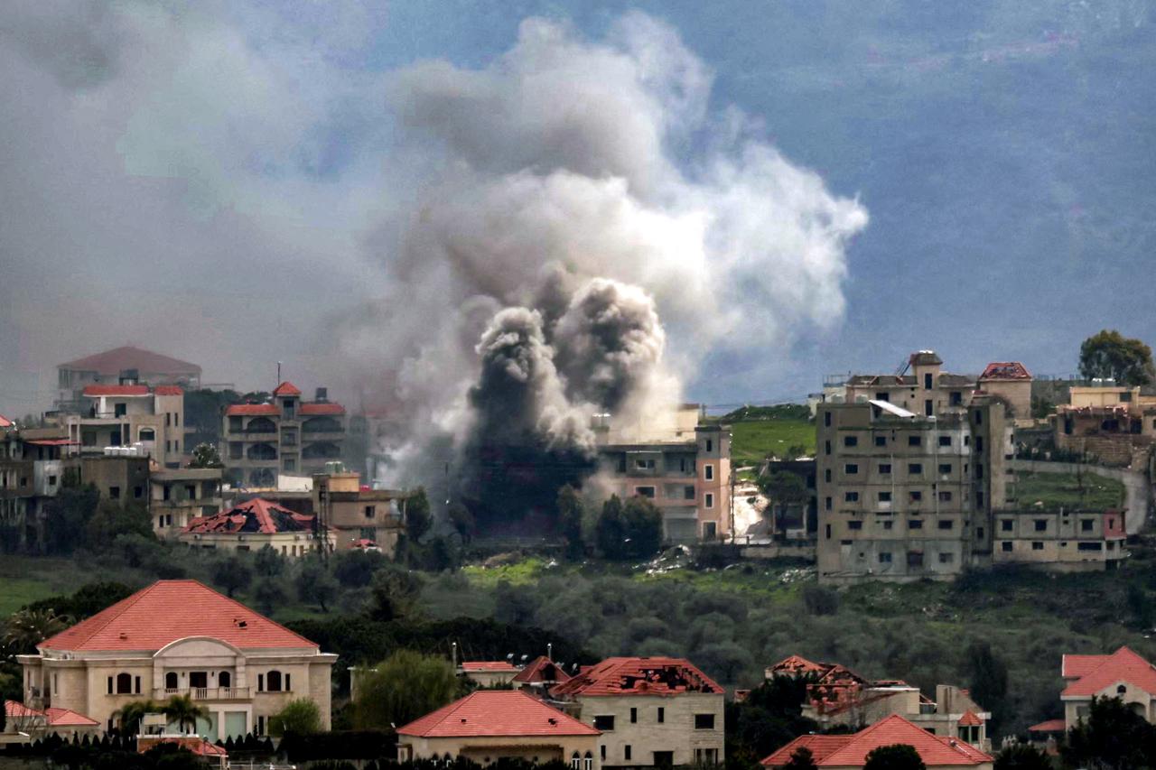 Smoke plumes rise following Israeli bombardment on the village of Khiam in southern Lebanon near the border with Israel, as seen from nearby Marjayoun, on March 16, 2026. (AFP Photo)