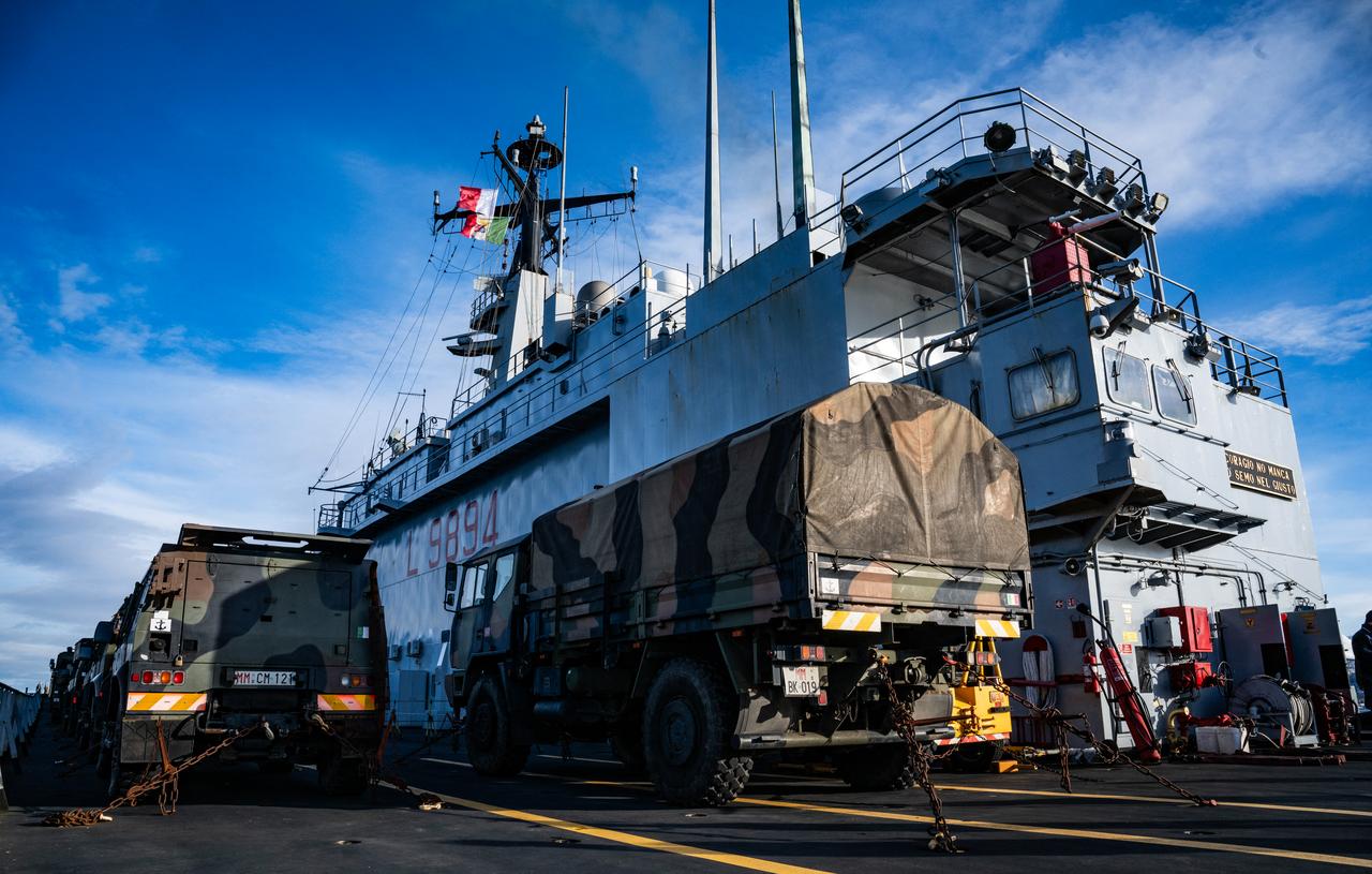 Transport vehicles are parked on the deck of the San Giusto, a San Giorgio-class amphibious transport dock of the Italian Navy, off the coast of Harstad on March 11, 2026. (AFP Photo)