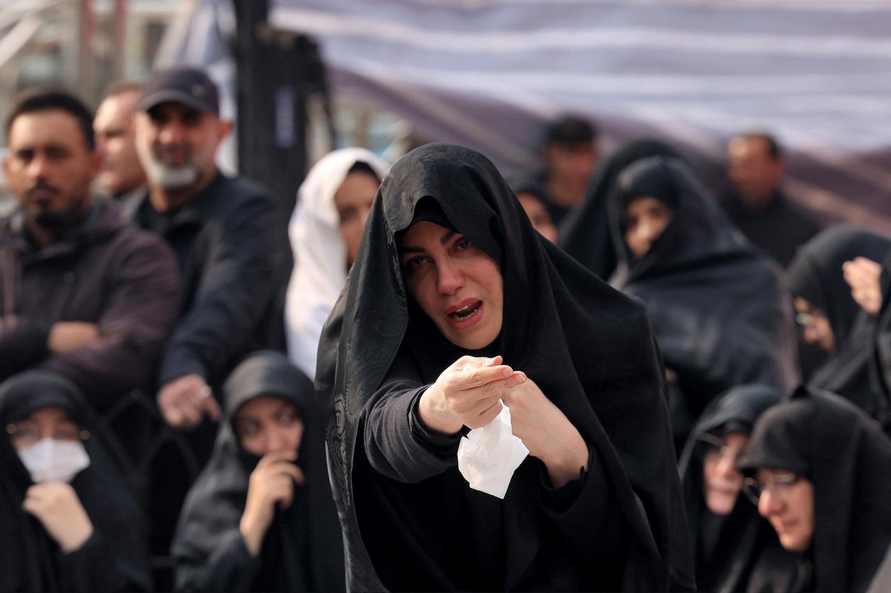 Family members and relatives of Ali Shamkhani, Iran's slain influential security adviser, react during his funeral at the Imamzadeh Saleh shrine in Tajrish Square in northern Tehran on March 14, 2026. (AFP Photo)