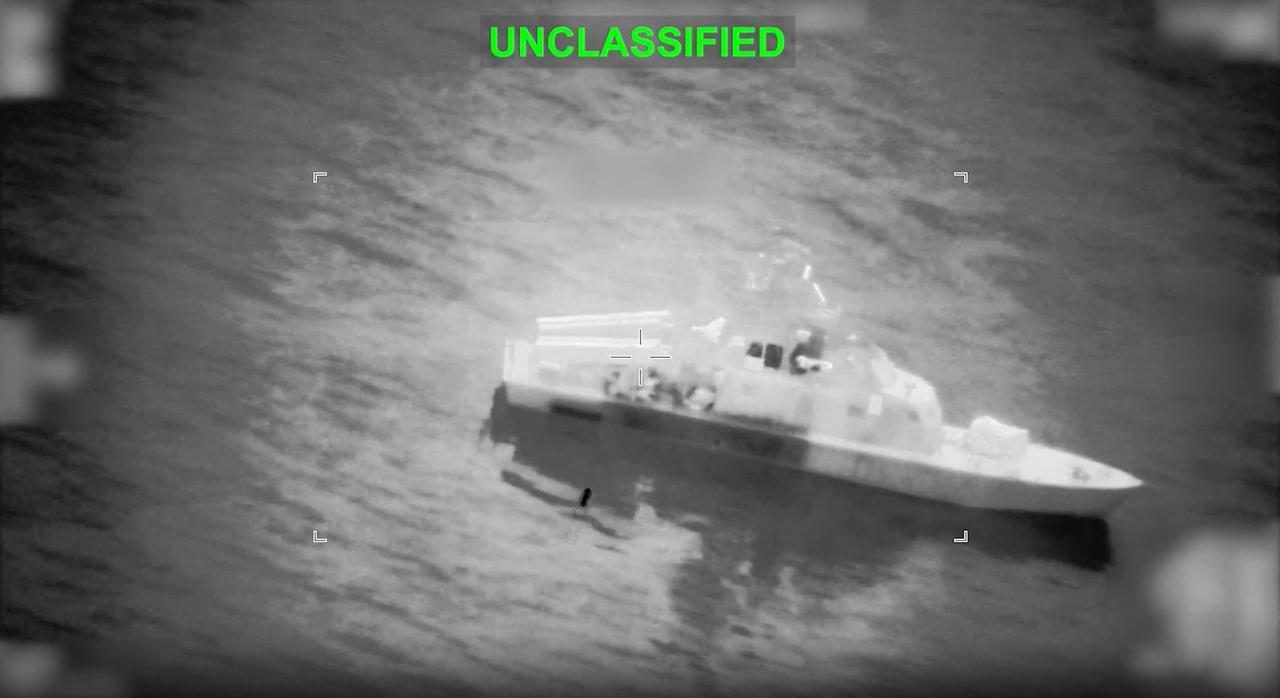 This screen grab obtained from video shows what they say is an Iranian naval vessel just before it is struck by a projectile "near the Strait of Hormuz" as part of "Operation Epic Fury" on March 10, 2026. (Photo by US Central Command (CENTCOM)/AFP)