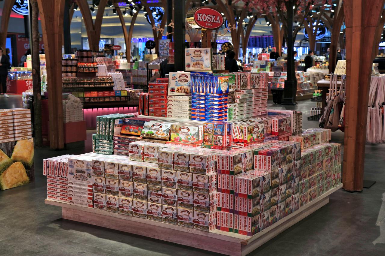 Boxes of Turkish delight and halva from the Koska brand are displayed at a duty-free shop at Istanbul Airport in Istanbul, Türkiye, April 11, 2023. (Adobe Stock Photo)