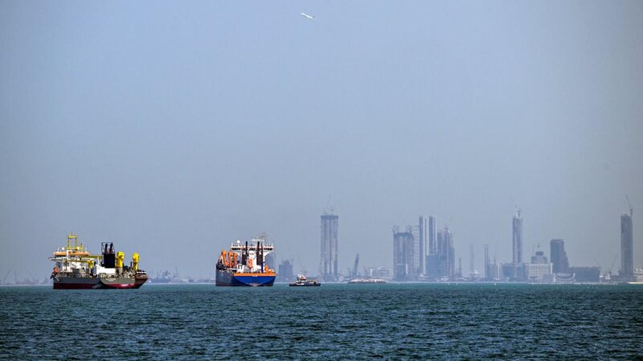Commercial vessels are pictured offshore in Dubai, United Arab Emirates on March 11, 2026. (AFP Photo)