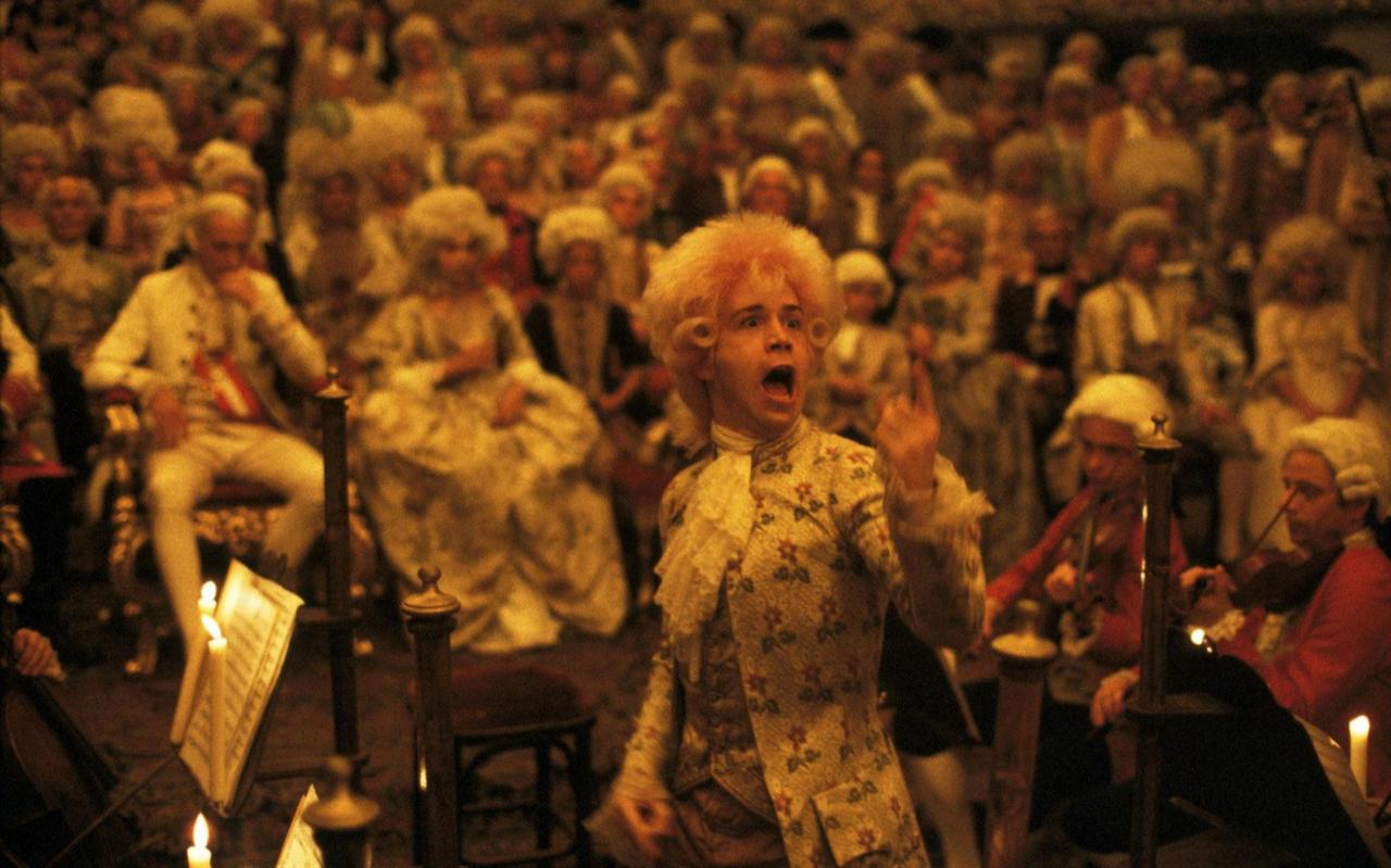 Mozart conducts with intensity during a performance scene in Amadeus, directed by Milos Forman (1984), accessed on March 17, 2026. (Photo via IMDb)