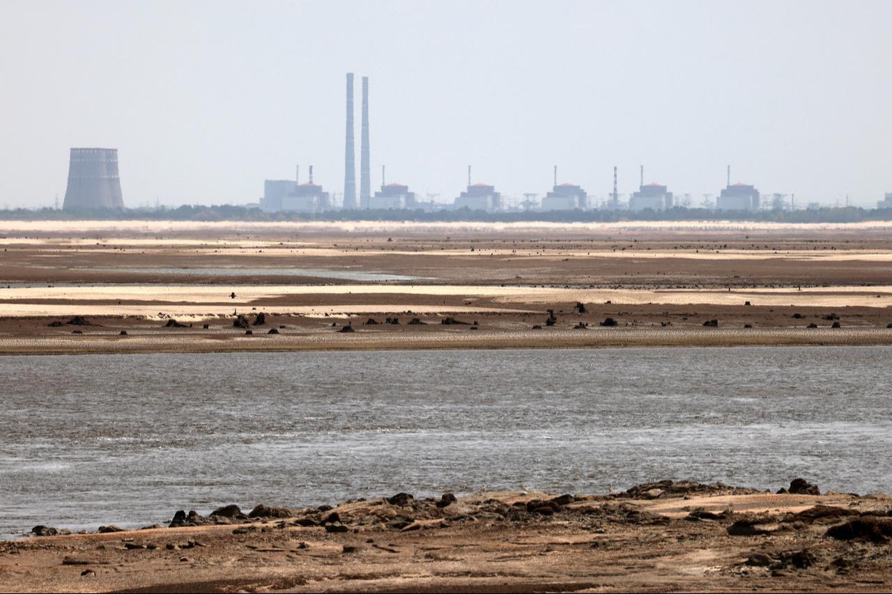 This photograph taken from Ukrainian city of Nikopol on July 7, 2023, shows the Zaporizhzhia nuclear power plant. (AFP Photo)