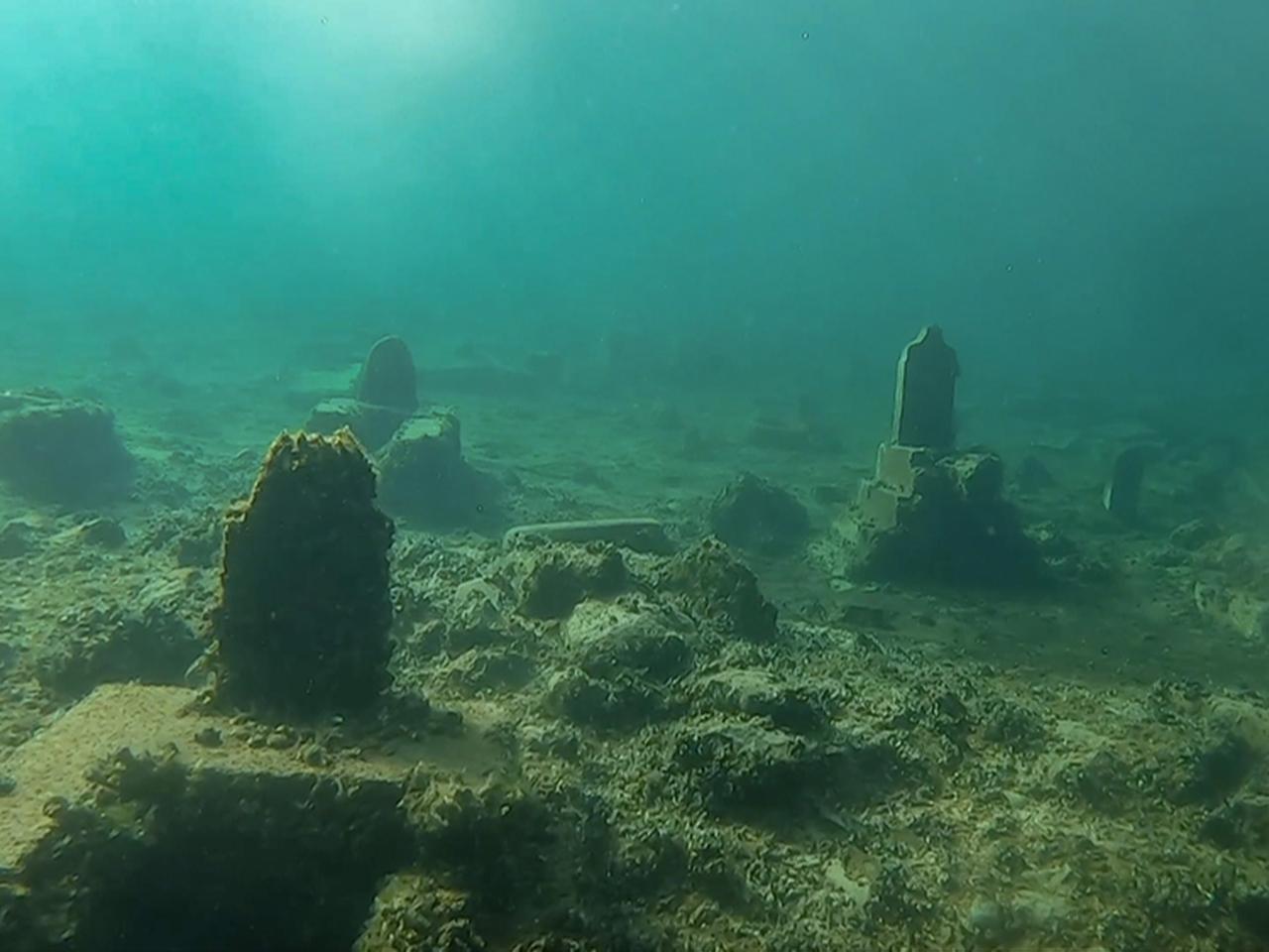 Stone grave markers and burial remains are seen underwater in the Dicle Dam reservoir, Diyarbakir, Türkiye, March 18, 2026. (AA Photo)