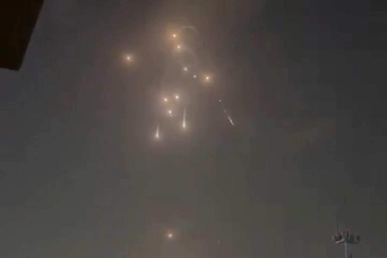 Burning debris rains over Dubai near International Convention and Exhibition Centre  Image