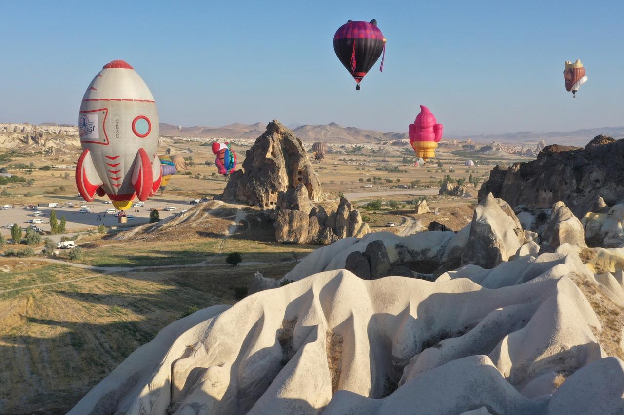 Hot air balloons with figures from various countries participating in the "Nevsehir Culture Route Festival" organized by the Ministry of Culture and Tourism flew in the skies of Cappadocia, Türkiye, Aug. 8, 2024 (AA Photo)