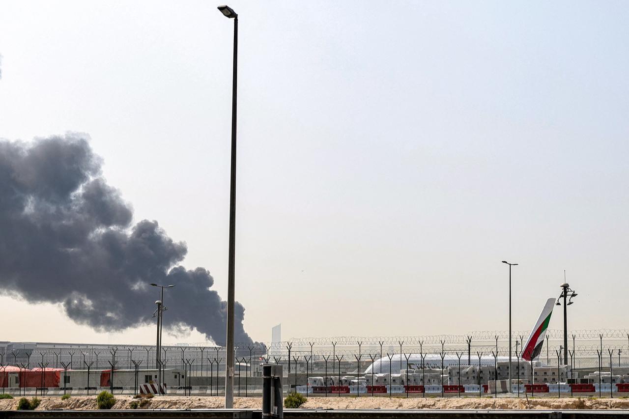 A smoke plume rises from an ongoing fire near Dubai International Airport in Dubai on March 16, 2026. (AFP Photo)