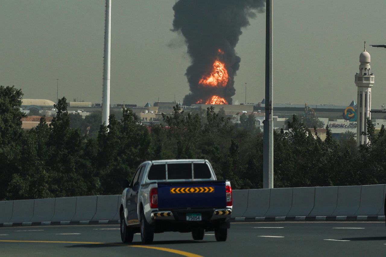 A smoke plume rises from an ongoing fire at Dubai International Airport in Dubai on March 16, 2026. (AFP Photo)