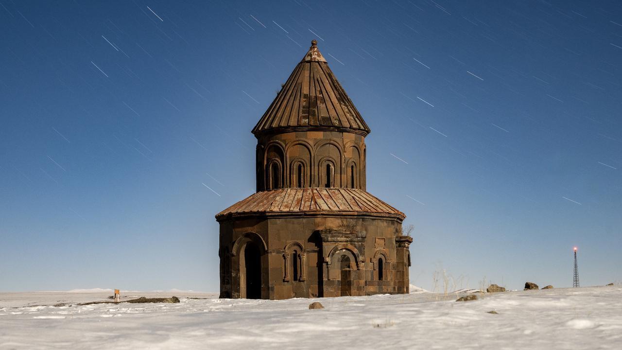 The snow-covered Abugamir Pahlavuni Church at the Ani archaeological site in Kars, Türkiye, February 11, 2026. (AA Photo)