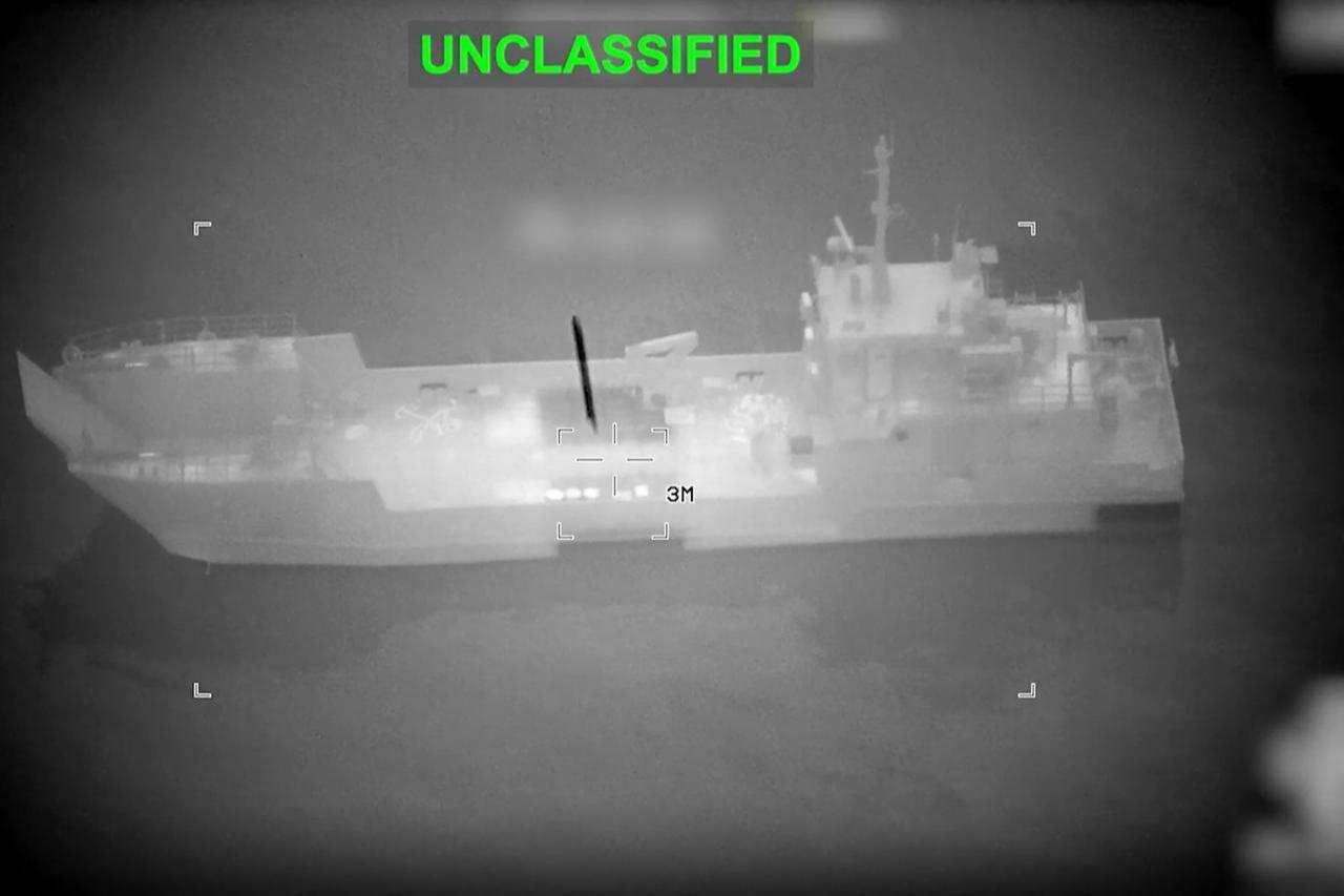 This screen grab obtained from video released by the US Central Command on their X account @CENTCOM on March 10, 2026 shows what they say is an Iranian naval vessel as it is struck by a projectile "near the Strait of Hormuz" as part of "Operation Epic Fury" on March 10, 2026. (AFP / US Central Command Photo)
