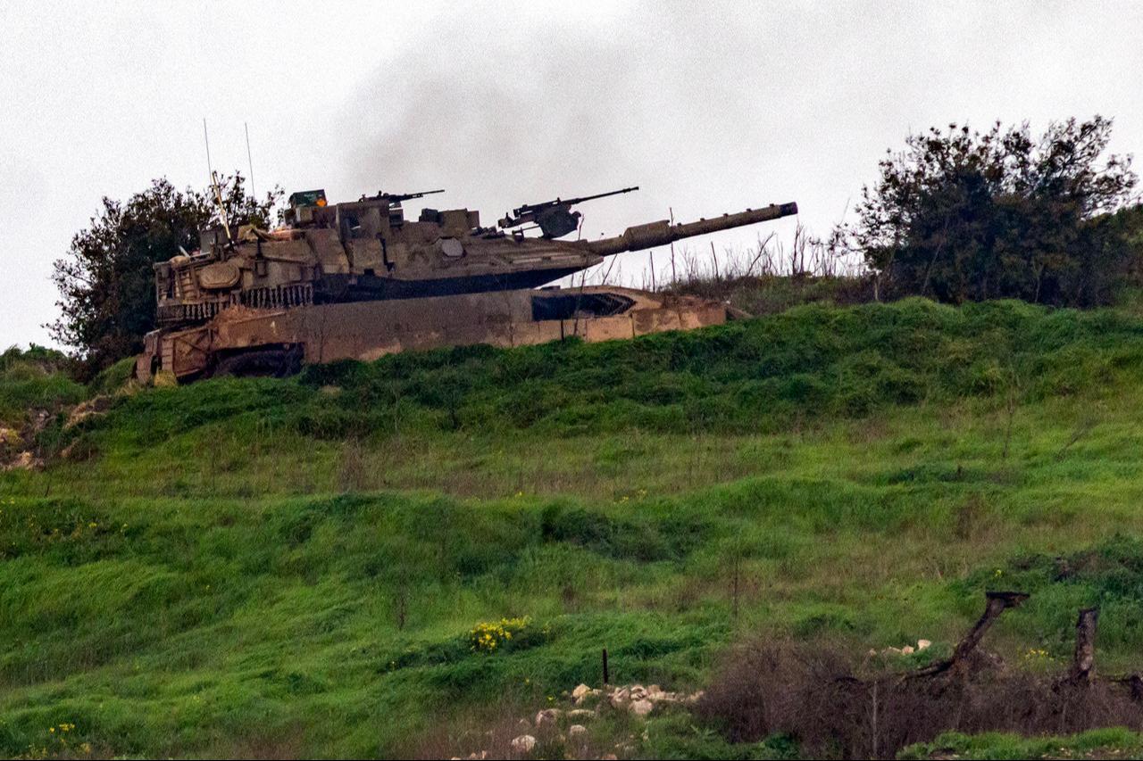 An Israeli army Merkava main battle tank manoeuvres across the border inside Lebanon as seen from the Upper Galilee in northern Israel, March 15, 2026. (AFP Photo)