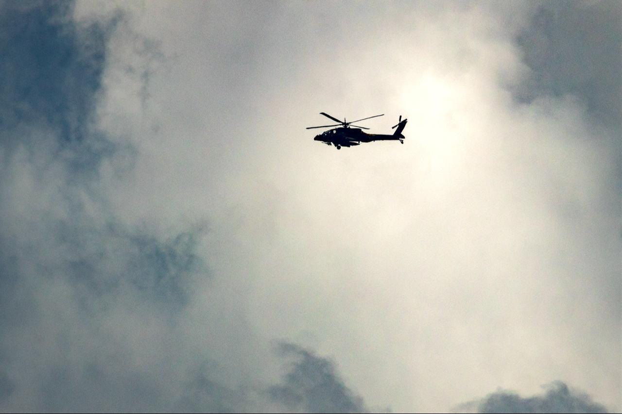 An Israeli helicopter gunship flies along the border with Lebanon in the Upper Galilee, northern Israel, on March 16, 2026. (AFP Photo)