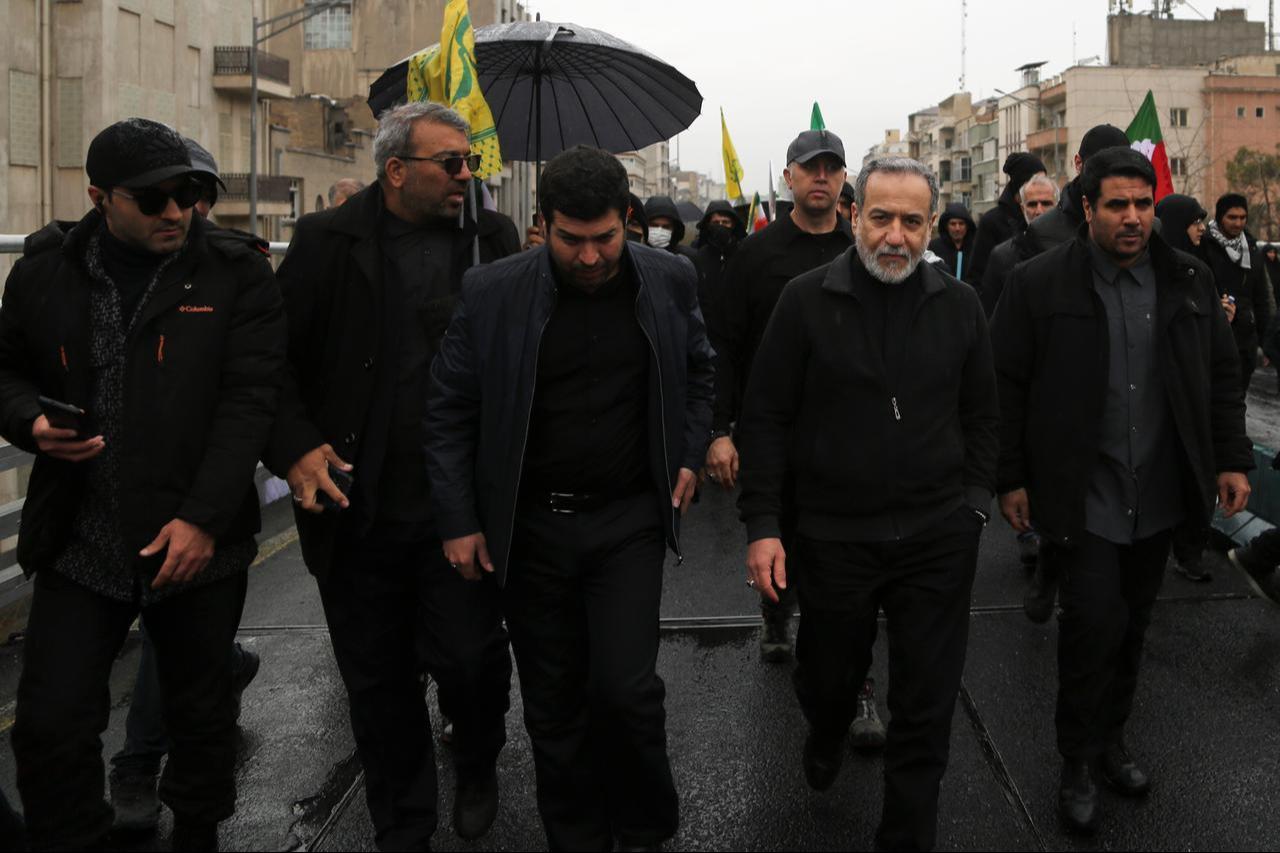 Iranian Foreign Minister Abbas Araghchi (2nd R) participates in the traditional Quds Day rally in the capital Tehran on March 13, 2026. (AA Photo)