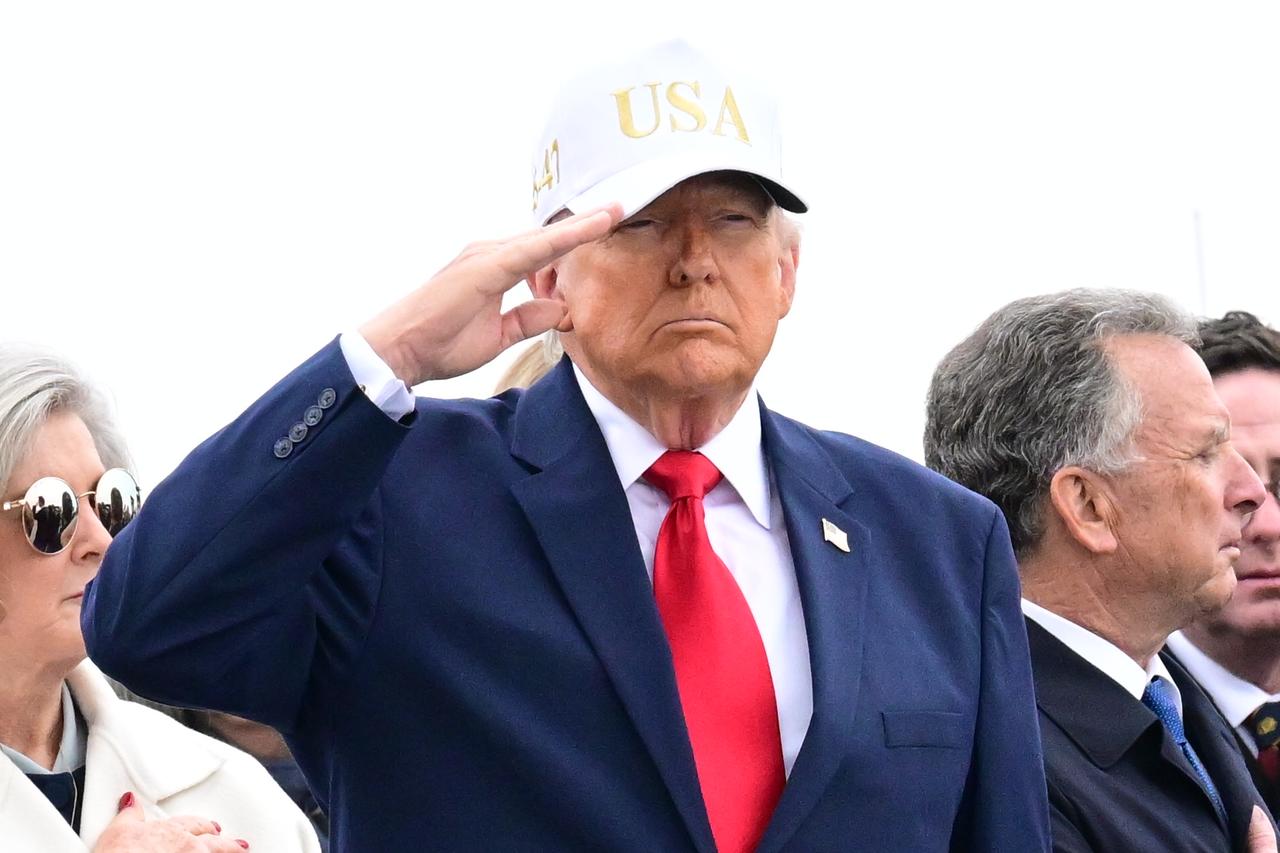 U.S. President Donald Trump salutes flagged-draped coffins containing the remains of the US soldiers killed in the retaliatory Iranian strike on Kuwait's Port of Shuaiba, in Dover, Delaware, United States on March 07, 2026. (AA Photo)